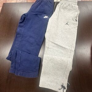 Two pairs of Nike size small sweatpants